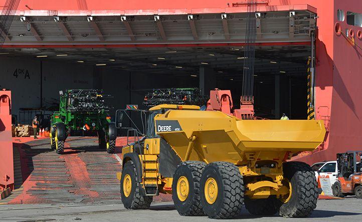 Heavy machinery loading onto a RoRo vessel